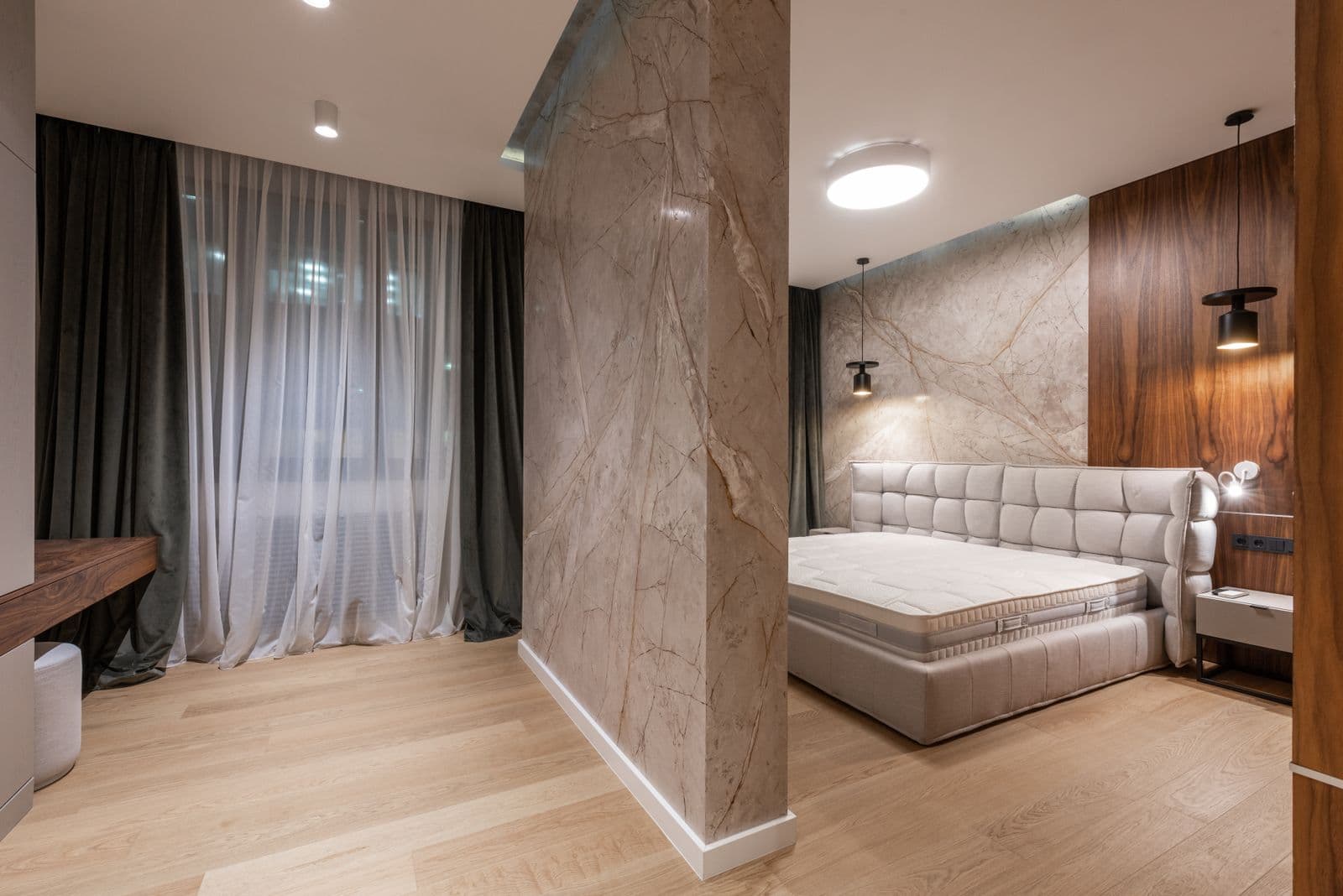 Walnut wall millwork in a finished bedroom