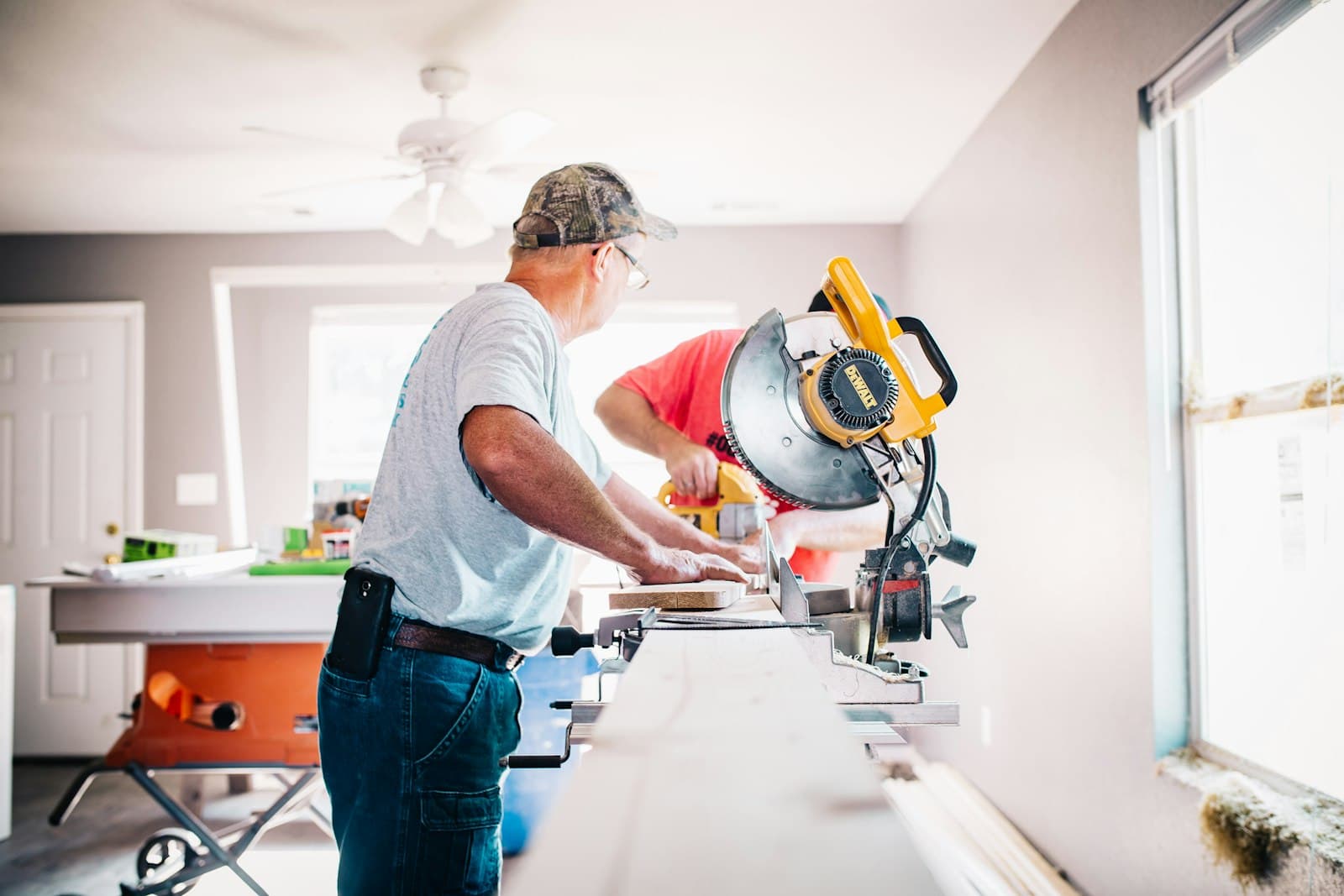 Crew cutting trim inside a Phoenix-area home