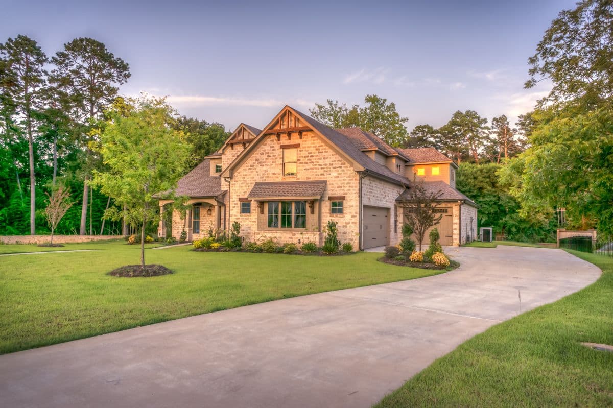 Front yard with a clean lawn and planting beds